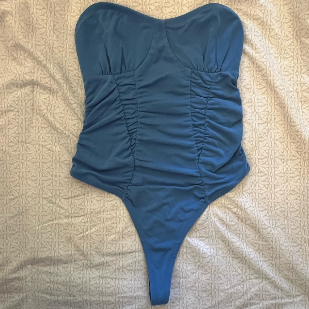 Out From Under blue bodysuit